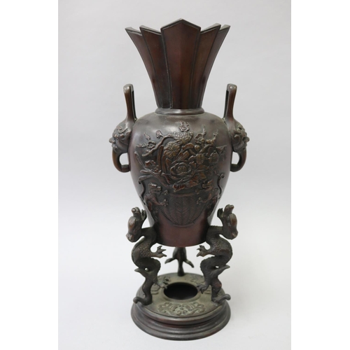 57 - Antique Asian bronze incense burner of vase form, with three dragon supports to the base & flared ri... 