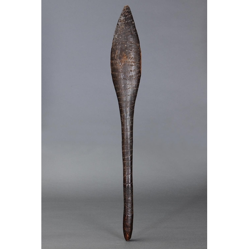 4 - EARLY INCISED CLUB, VICTORIA, Carved and engraved hardwood (with custom stand) Wooden club, tapered ... 