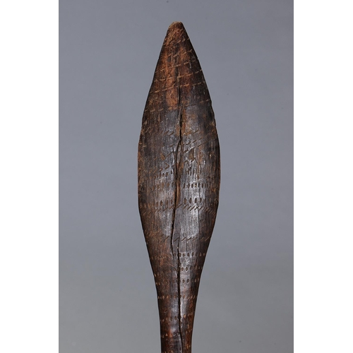 4 - EARLY INCISED CLUB, VICTORIA, Carved and engraved hardwood (with custom stand) Wooden club, tapered ... 