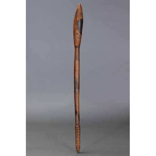 29 - THROWING CLUB, VICTORIA, Carved and engraved hardwood (with custom stand) The curving shaft of circu... 
