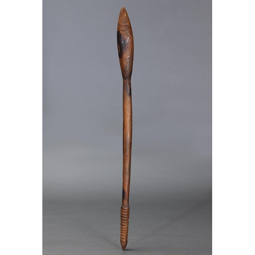 29 - THROWING CLUB, VICTORIA, Carved and engraved hardwood (with custom stand) The curving shaft of circu... 