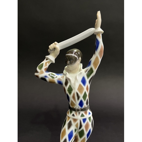 19 - Bing and Grondahl Harlequin figure with a sword no 2354 HE, approx 28cm H