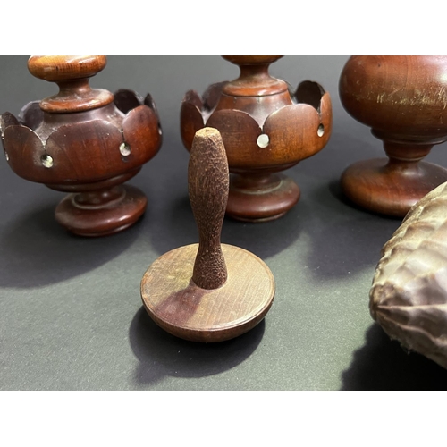 21 - Group lot, of carved wood items, two carved shells, pair of antique finials, single finial, mushroom... 