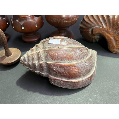 21 - Group lot, of carved wood items, two carved shells, pair of antique finials, single finial, mushroom... 