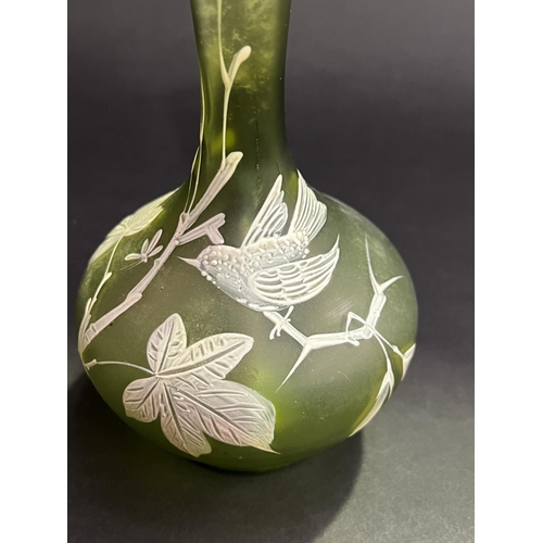 6 - Pair of antique green glass bottle vases, raised enamel decoration, each approx 21cm H (2)
