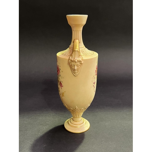 53 - Twin handle blush ivory mask head urn, approx 27cm H x 9cm W