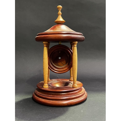 58 - R Reedman cedar and silky oak watch or clock movement holder, approx 33cm H x 20cm Dia