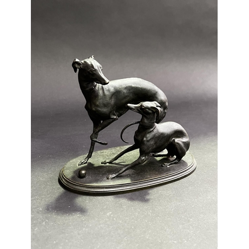 60 - Bronze figure group of two whippets. on a oval base, unsigned, one tail broken off but present, appr... 
