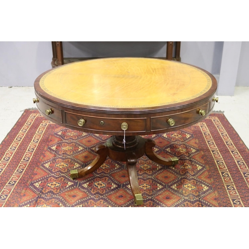 52 - Fine Regency revival drum table, with tooled leather top, four dummy drawers and four drawers, with ... 