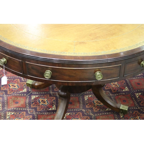 52 - Fine Regency revival drum table, with tooled leather top, four dummy drawers and four drawers, with ... 