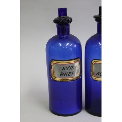 3029 - Pair of blue glass bottles, each approx 27cm H (2)