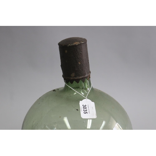 3035 - Antique green glass onion bottle with lid, TR: LAVAND:CO:, approx 28cm H