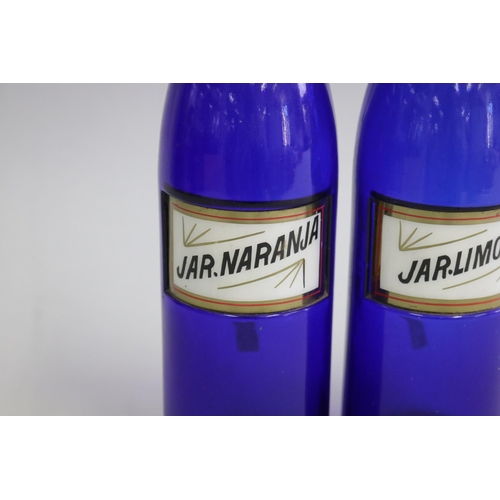 3042 - Pair of antique Bristol blue glass bottles, JAR. LIMON and JAR. NARANJA, each approx 28cm H (2)