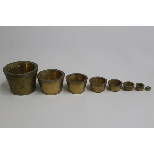 3058 - Antique Victorian Brass Graduated cup weights, from 5oz to 32oz Troy, approx 6cm H x 9cm Dia and sma... 