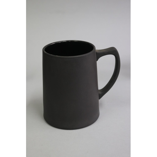 3140 - Two Wedgwood black basalt mugs, vase and small jug, approx 13cm H and shorter (4)