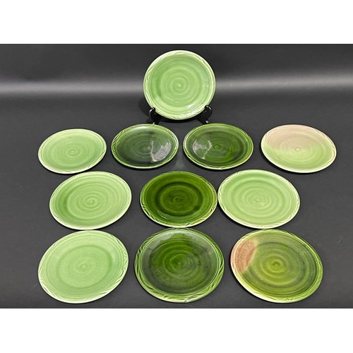 36 - Eleven Southern Highlands green glaze pottery plates, each approx 18cm Dia (11)