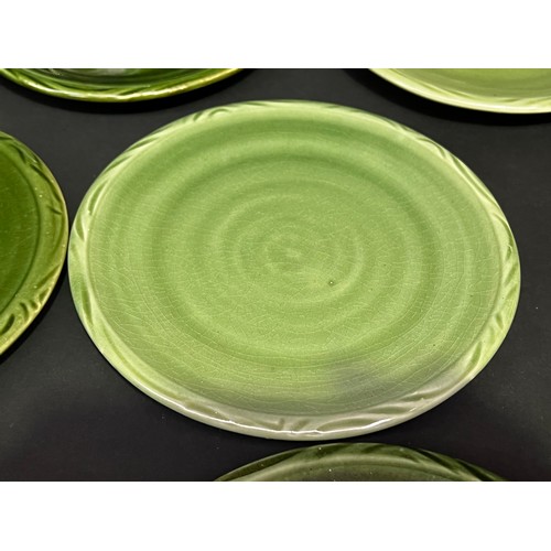 36 - Eleven Southern Highlands green glaze pottery plates, each approx 18cm Dia (11)