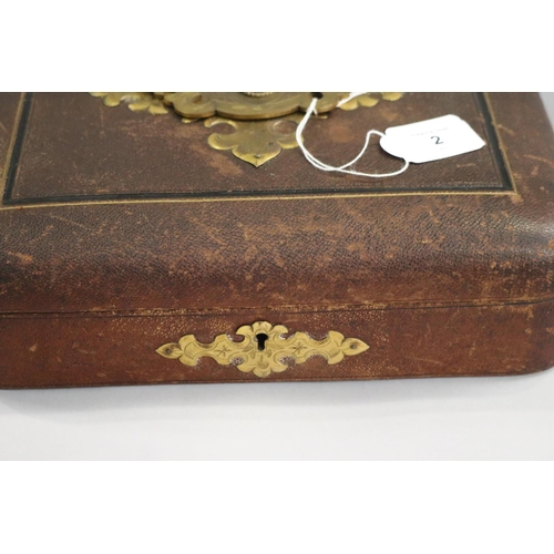 2 - Antique leather covered jewel box with oversize patinated brass jewelled central panel/handle, appro... 