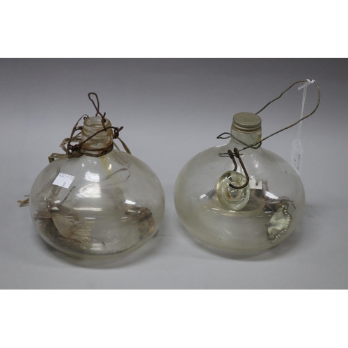 22 - Pair of antique glass fly catchers, with deceased contents, each approx 15cm H x 15cm Dia (2)