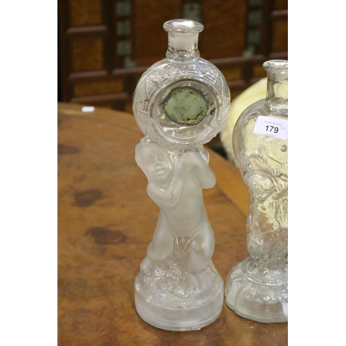 84 - Two French figural putti decanters, approx 36cm H and shorter (2)