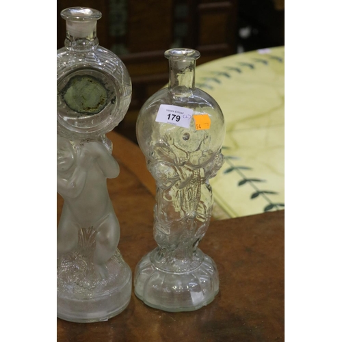 84 - Two French figural putti decanters, approx 36cm H and shorter (2)