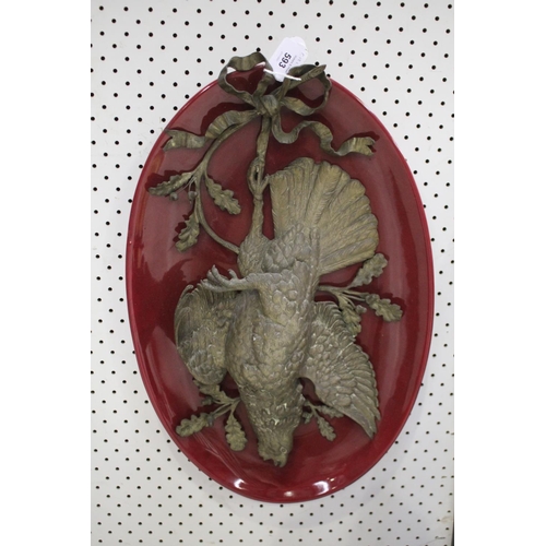 94 - Antique French rouge ground pottery plate with mounted hanging brass pheasant, game trophy, approx 5... 