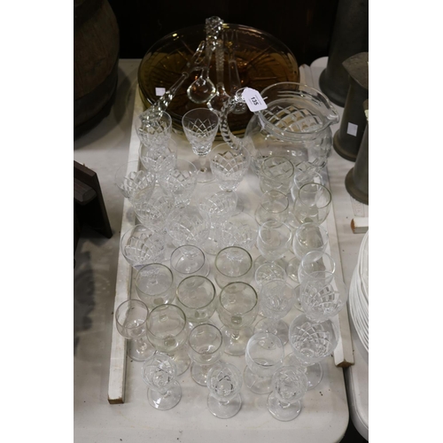 135 - Crystal and glass to include a jug, coloured glass plates and servers, approx 29cm Dia and smaller