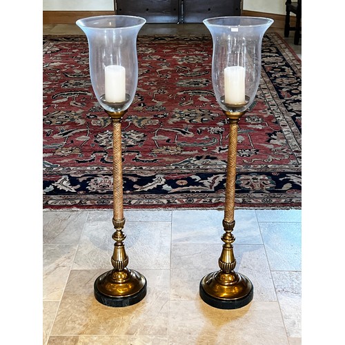1021 - Pair of tall storm lights, bell shaped glass shades, turned fluted twist columns on turned fluted br... 