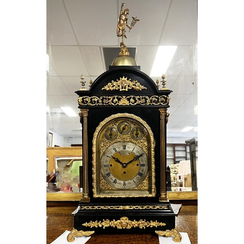 Antique Victorian George II revival bracket clock of large size by J.C. Turner of London. The arch topped dial with silvered chapter ring beneath subsidiary dials for chime/silent, fast slow and Cambridge or eight bells chimes, with a three train movement striking on eight bells and five coiled gongs. With heavy carrying handles, pierced side panels and fluted columns, has pendulum key and back cover key (in office 8000.117), recently restored and cleaned, approx 70cm H x 43cm W x 32cm D Running and keeping time