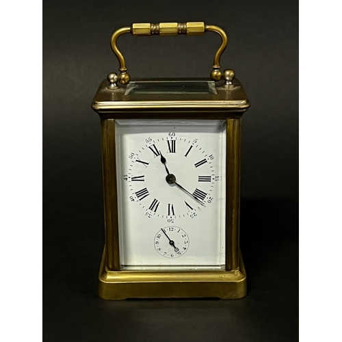 1010 - Antique brass cased carriage clock, in original carry case. Bell strike alarm movement with sub alar... 