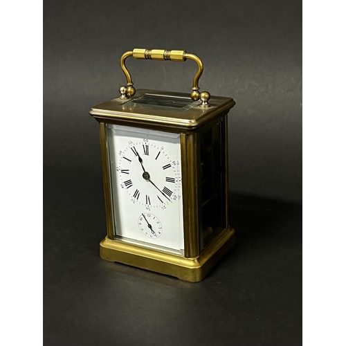 1010 - Antique brass cased carriage clock, in original carry case. Bell strike alarm movement with sub alar... 