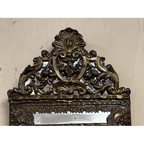 1022 - Antique 19th century French repousse brass cushion mirror, approx 59cm H x 32cm W