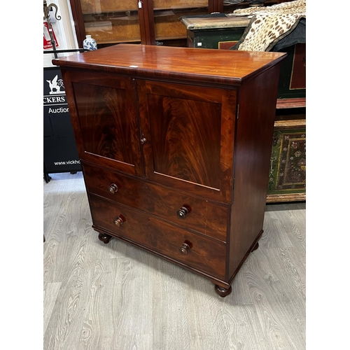 1035 - Fine antique mahogany bachelors small scale press on chest. Two door top over a two drawer base, all... 