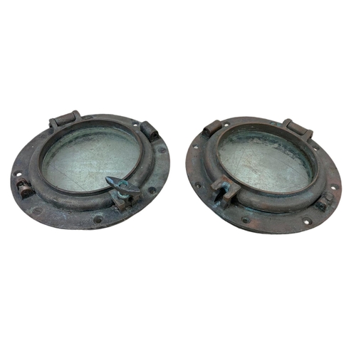 24 - Pair of late 19th/early 20th century brass ships port holes. 25cm
