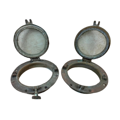 24 - Pair of late 19th/early 20th century brass ships port holes. 25cm