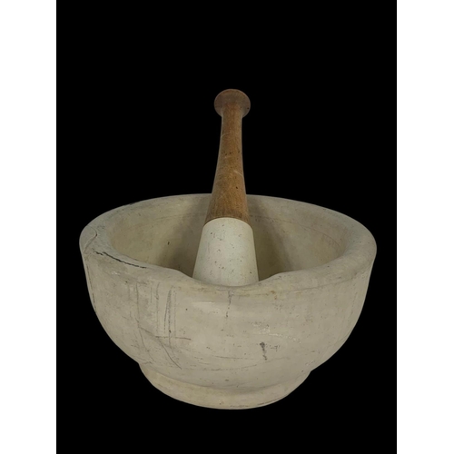 12 - A large mortar and pestle. 21 x 21 x 11cm.