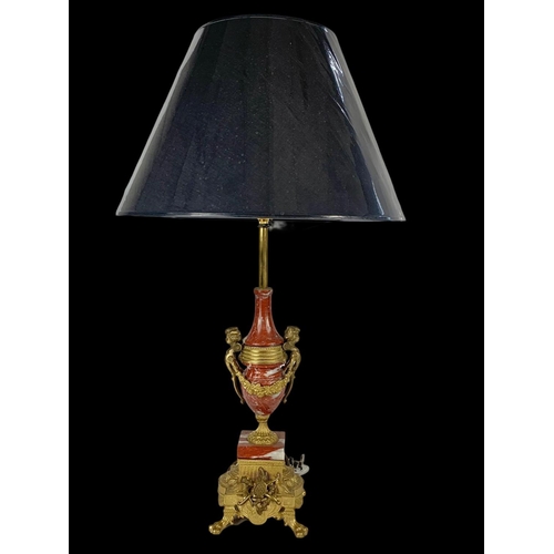 14 - An ornate brass and marble table lamp. Base measures 54cm. 77cm with shade.