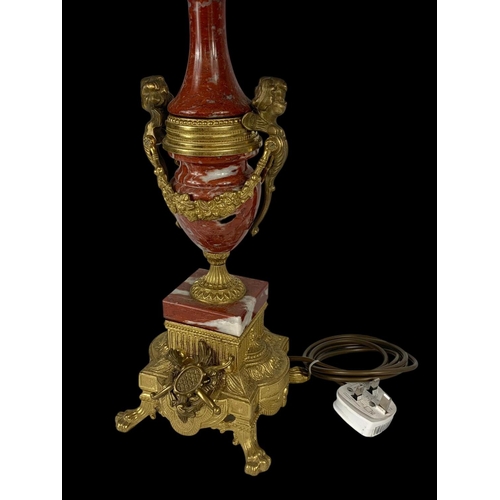 14 - An ornate brass and marble table lamp. Base measures 54cm. 77cm with shade.
