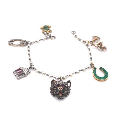 18 - Charm bracelet with pearls and six charms, including, enamel and diamond set frog, diamond set owl, ... 
